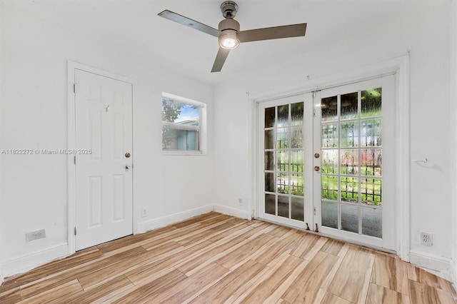 6073 NW 27th St, Margate, FL 33063 - empty room featuring light wood-type flooring, french doors, and a ceiling fan