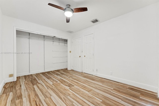 6073 NW 27th St, Margate, FL 33063 - unfurnished bedroom with light wood-type flooring, a ceiling fan, and a closet