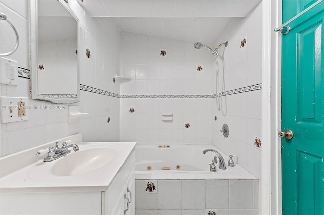 6073 NW 27th St, Margate, FL 33063 - full bathroom featuring vanity, a combined bath / shower with jetted tub, and tile walls