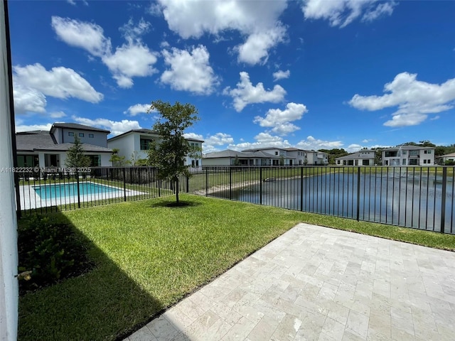 3511 Ashwood Cir S, Hollywood, FL 33312 - fenced backyard with a residential view, a patio, and a water view