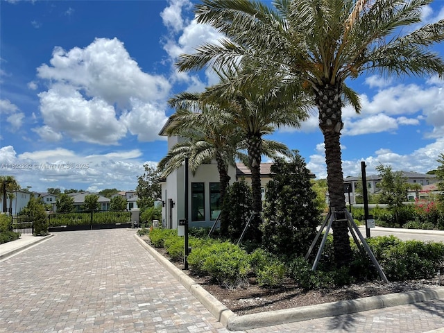 3511 Ashwood Cir S, Hollywood, FL 33312 - view of home's exterior featuring a gate, a residential view, and stucco siding
