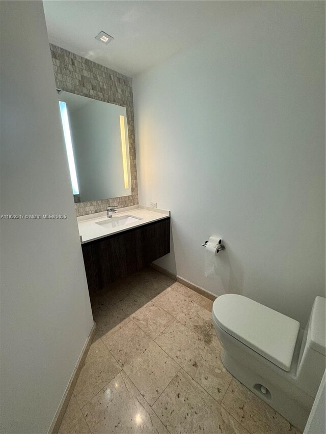 88 SW 7th St Unit 3012, Miami, FL 33130 - bathroom with vanity and decorative backsplash