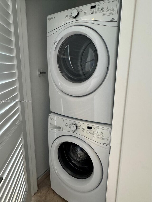 88 SW 7th St Unit 3012, Miami, FL 33130 - laundry room featuring stacked washing machine and dryer