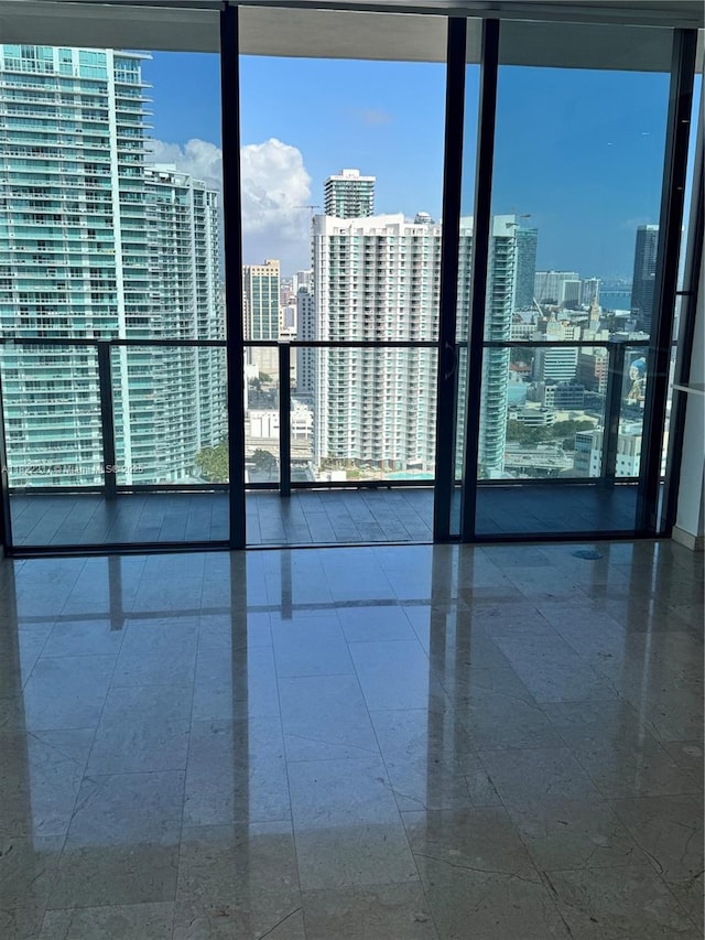 88 SW 7th St Unit 3012, Miami, FL 33130 - empty room with a city view, healthy amount of natural light, and floor to ceiling windows