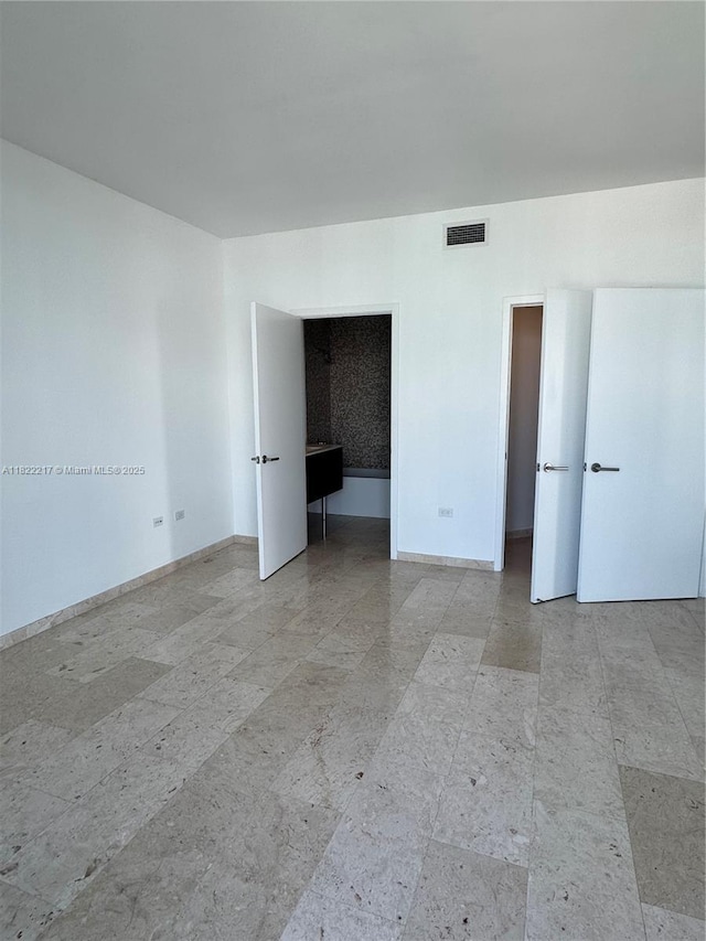88 SW 7th St Unit 3012, Miami, FL 33130 - empty room featuring baseboards