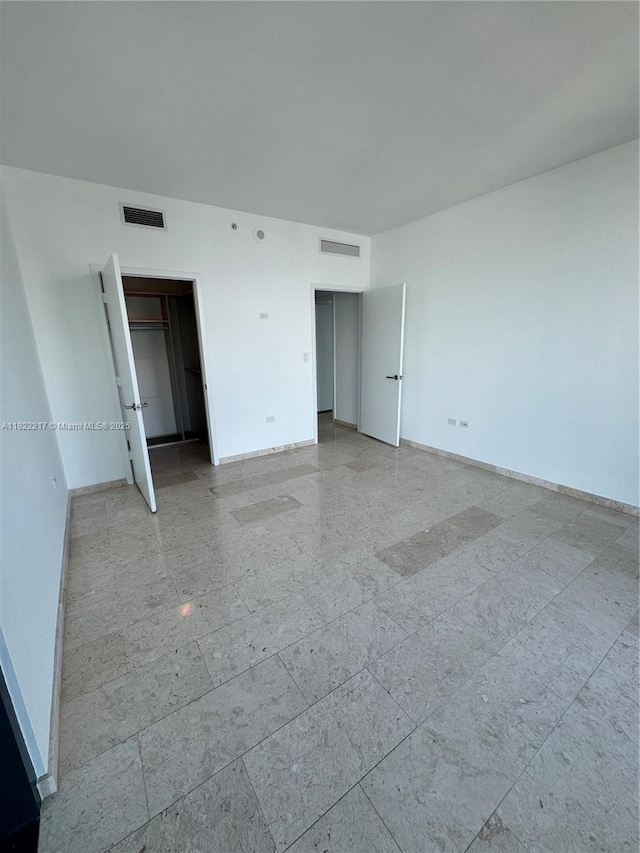 88 SW 7th St Unit 3012, Miami, FL 33130 - unfurnished bedroom featuring baseboards