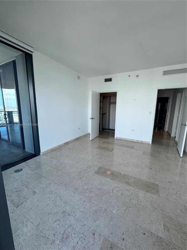 88 SW 7th St Unit 3012, Miami, FL 33130 - empty room featuring baseboards