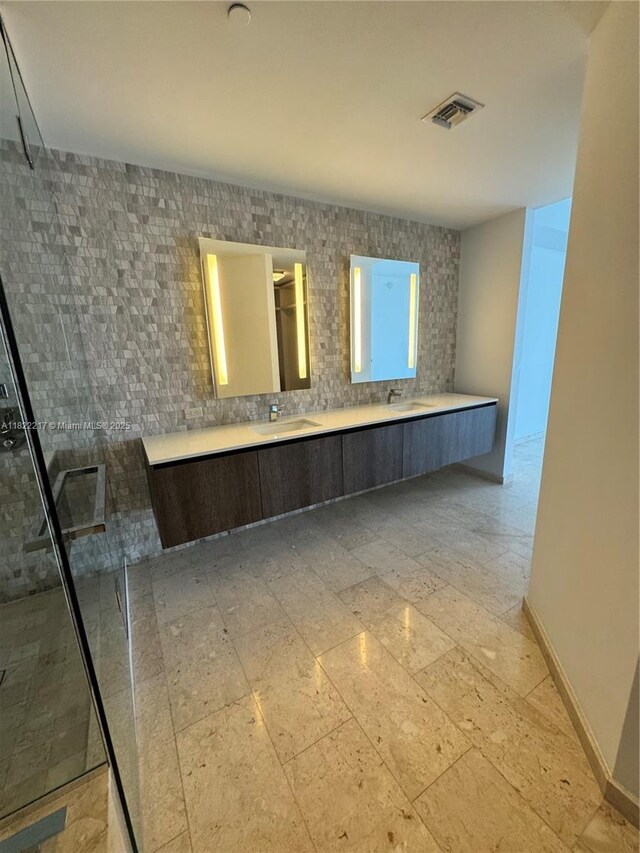 88 SW 7th St Unit 3012, Miami, FL 33130 - bathroom with double vanity and a tile shower