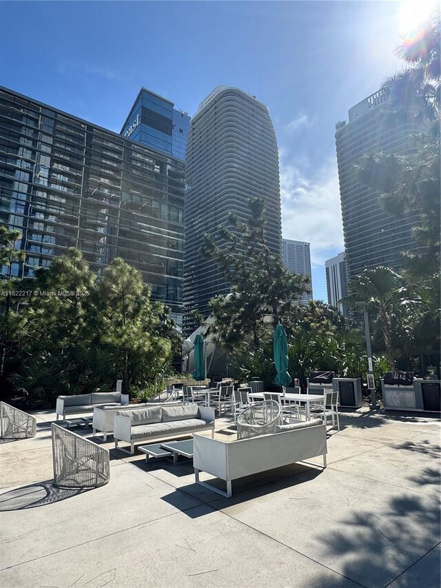 88 SW 7th St Unit 3012, Miami, FL 33130 - view of home's community with a patio area, a city view, and outdoor lounge area
