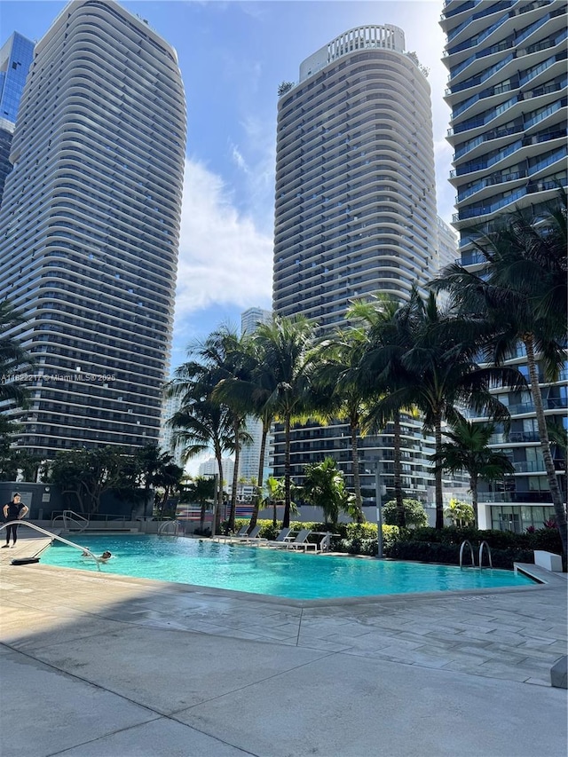 88 SW 7th St Unit 3012, Miami, FL 33130 - community pool featuring a patio