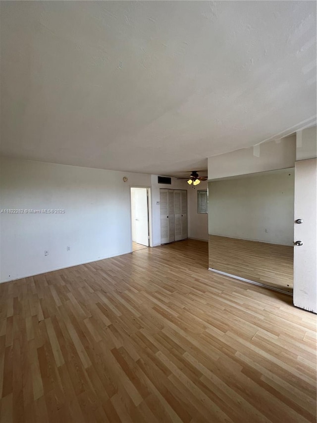 1475 NE 125th Ter Unit 511B, North Miami, FL 33161 - unfurnished room with light wood finished floors and a ceiling fan