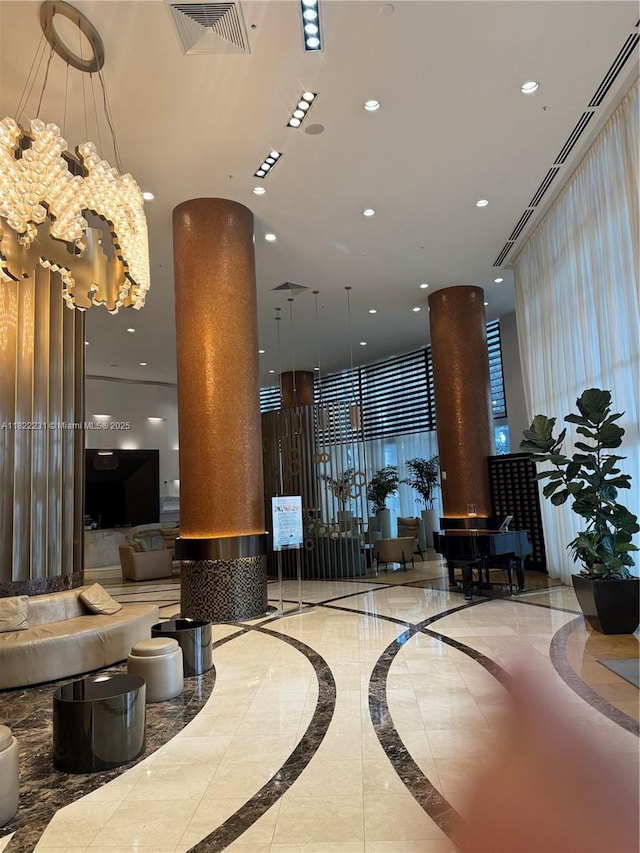 18001 Collins Ave Unit 918, Sunny Isles Beach, FL 33160 - building lobby with a high ceiling and recessed lighting