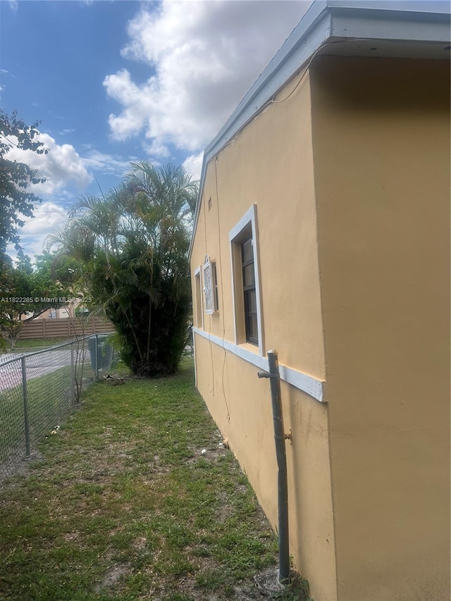 821 NW 183rd Dr, Miami Gardens, FL 33169 - view of side of home featuring stucco siding