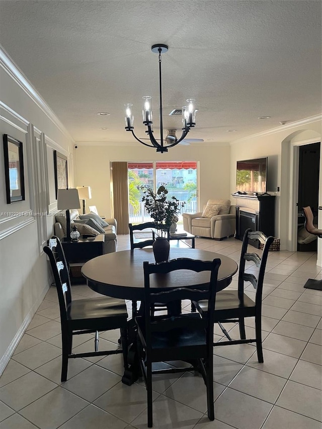 16388 SW 47th Ter, Miami, FL 33185 - dining room featuring a chandelier, crown molding, light tile patterned flooring, and a textured ceiling