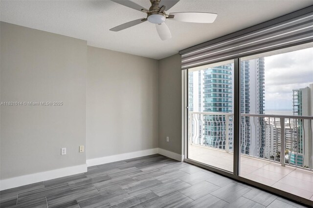1200 Brickell Bay Dr Unit 2501, Miami, FL 33131 - unfurnished room with ceiling fan and wood finished floors