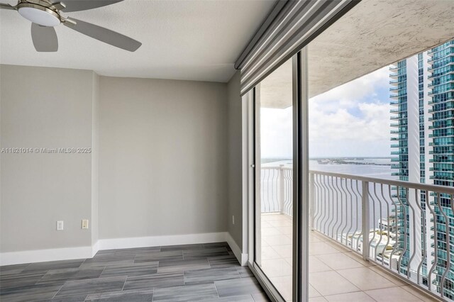 1200 Brickell Bay Dr Unit 2501, Miami, FL 33131 - spare room with a water view and ceiling fan