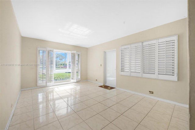 9920 Collins Ave Unit 2, Bal Harbour, FL 33154 - unfurnished room with baseboards and tile patterned flooring