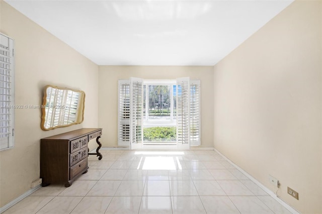 9920 Collins Ave Unit 2, Bal Harbour, FL 33154 - unfurnished room featuring light tile patterned flooring and baseboards
