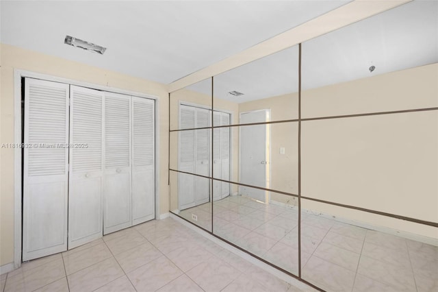 9920 Collins Ave Unit 2, Bal Harbour, FL 33154 - unfurnished bedroom featuring a closet
