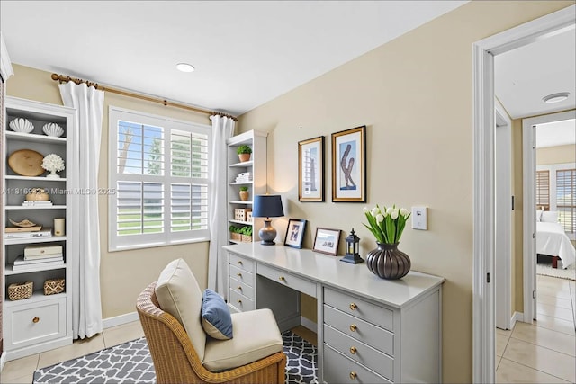 9920 Collins Ave Unit 2, Bal Harbour, FL 33154 - home office featuring healthy amount of natural light, light tile patterned flooring, and built in desk