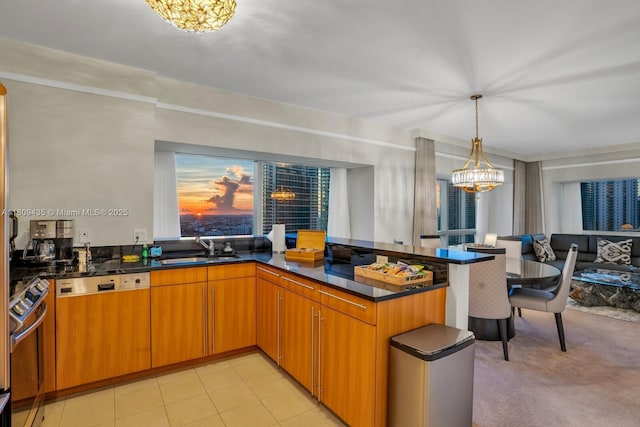 1435 Brickell Ave Unit 3012, Miami, FL 33131 - kitchen with a chandelier, paneled dishwasher, a peninsula, dark stone counters, and oven