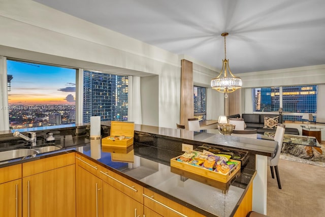 1435 Brickell Ave Unit 3012, Miami, FL 33131 - kitchen featuring a chandelier, light carpet, and pendant lighting