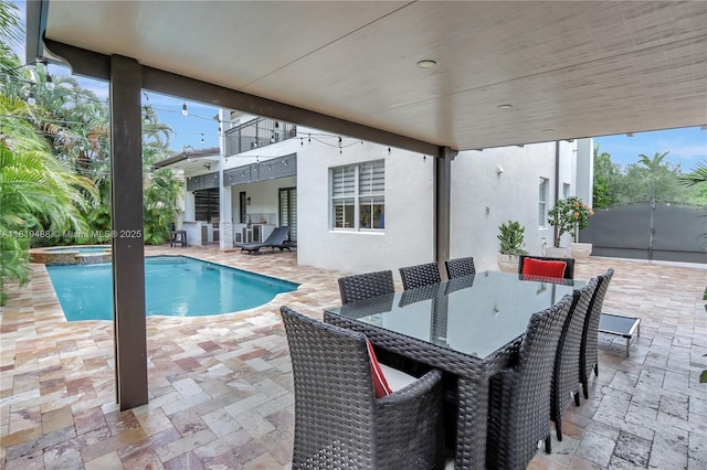8902 NW 178th Ln, Hialeah, FL 33018 - view of pool with a patio, outdoor dining space, and a pool with connected hot tub