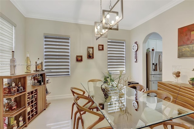 8902 NW 178th Ln, Hialeah, FL 33018 - dining space featuring arched walkways, ornamental molding, a chandelier, and plenty of natural light