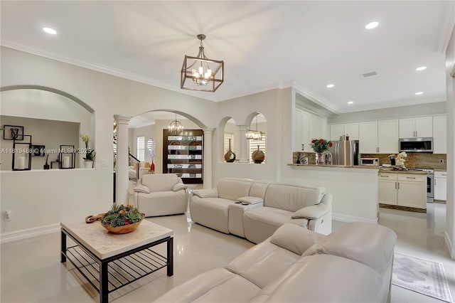 8902 NW 178th Ln, Hialeah, FL 33018 - living room with decorative columns, arched walkways, a chandelier, light tile patterned floors, and crown molding