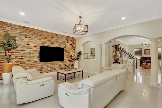 8902 NW 178th Ln, Hialeah, FL 33018 - living room with arched walkways, a chandelier, light tile patterned floors, stairway, and ornamental molding