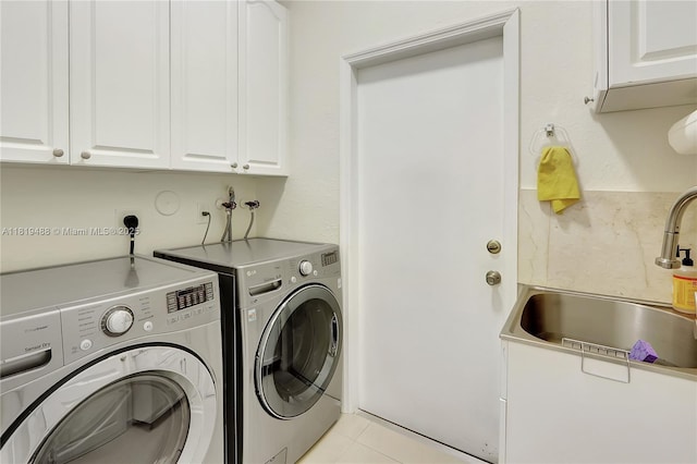 8902 NW 178th Ln, Hialeah, FL 33018 - laundry area featuring cabinet space, washing machine and dryer, and light tile patterned flooring