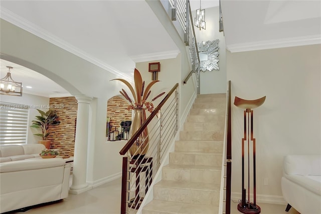 8902 NW 178th Ln, Hialeah, FL 33018 - staircase with arched walkways, a chandelier, crown molding, and ornate columns