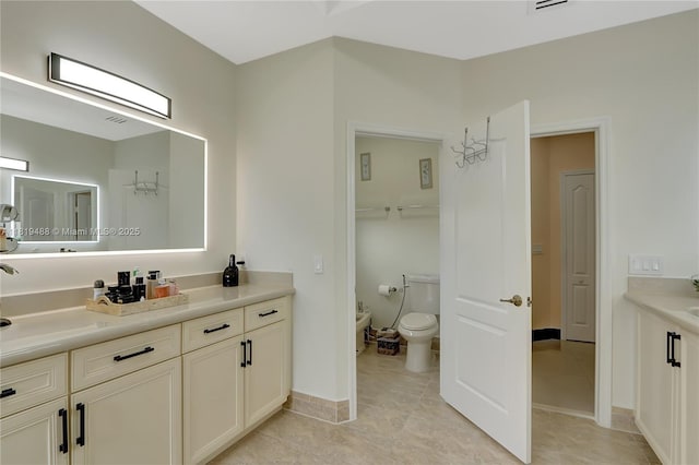 8902 NW 178th Ln, Hialeah, FL 33018 - bathroom with a bidet, vanity, and tile patterned floors
