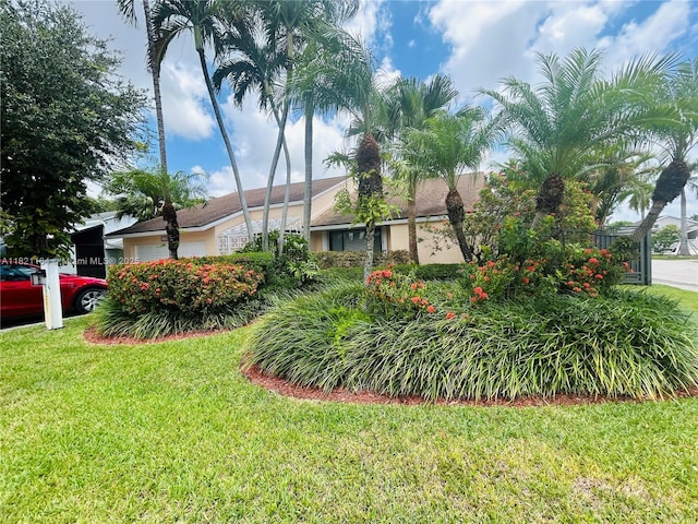 13205 SW 119th St, Miami, FL 33186 - view of front of house with a front yard and an attached garage