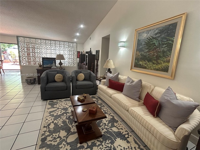 13205 SW 119th St, Miami, FL 33186 - living room featuring lofted ceiling, light tile patterned floors, a textured ceiling, and recessed lighting