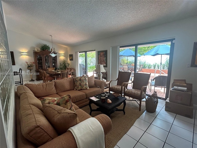 13205 SW 119th St, Miami, FL 33186 - living area featuring a textured ceiling, light tile patterned floors, and vaulted ceiling