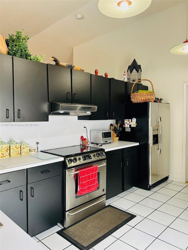 13205 SW 119th St, Miami, FL 33186 - kitchen featuring appliances with stainless steel finishes, under cabinet range hood, light countertops, and dark cabinetry