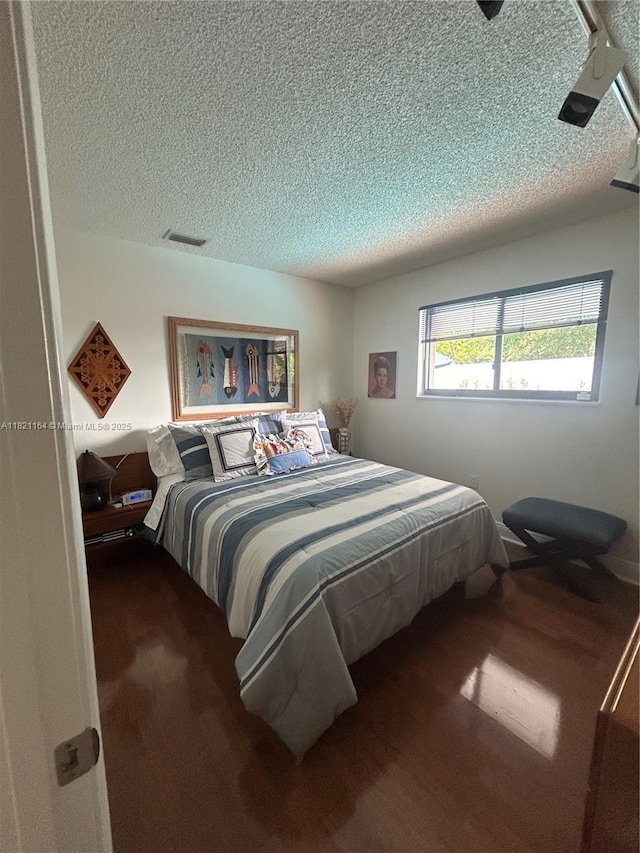 13205 SW 119th St, Miami, FL 33186 - bedroom with wood finished floors and a textured ceiling