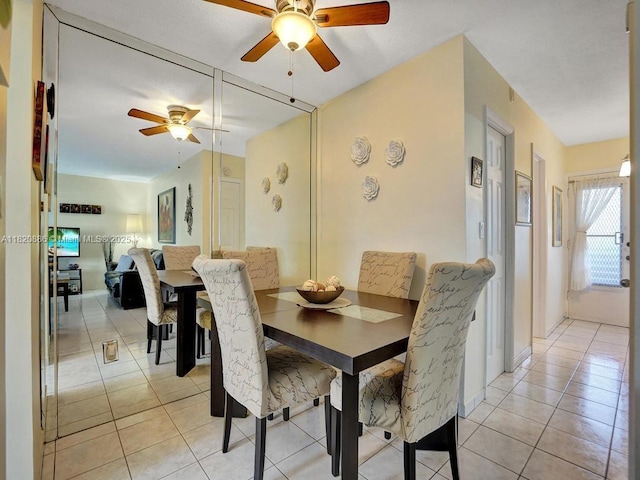 16901 NE 13th Ave Unit 110, Miami, FL 33162 - dining room featuring ceiling fan and light tile patterned floors