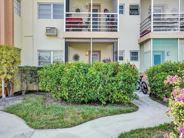 16901 NE 13th Ave Unit 110, Miami, FL 33162 - view of building exterior featuring a wall mounted air conditioner