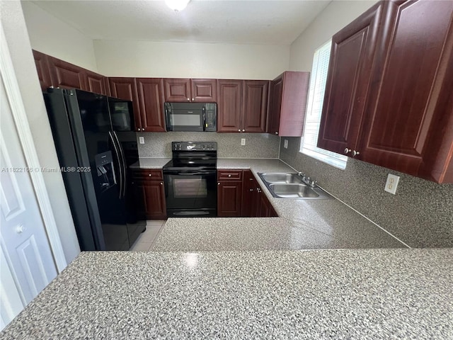 2620 SE 14th Ave Unit 304, Homestead, FL 33035 - kitchen with black appliances, light countertops, and decorative backsplash