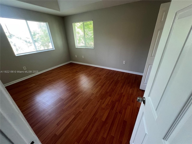 2620 SE 14th Ave Unit 304, Homestead, FL 33035 - spare room with dark wood-style floors and baseboards