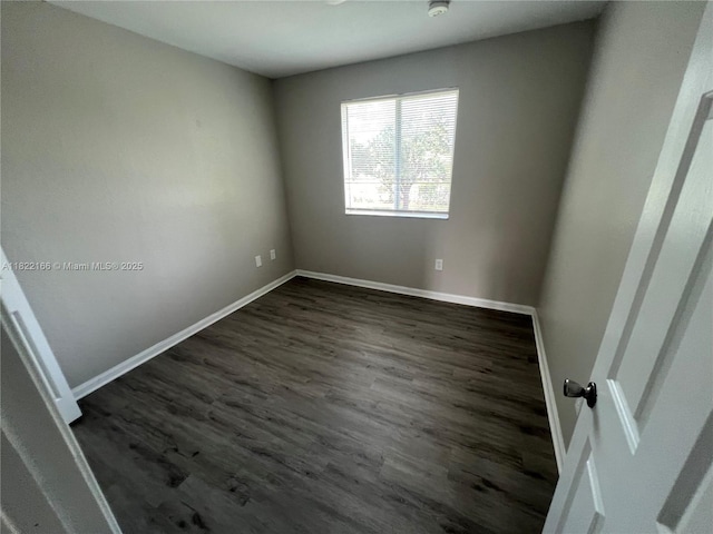 2620 SE 14th Ave Unit 304, Homestead, FL 33035 - unfurnished room featuring baseboards and dark wood-style flooring