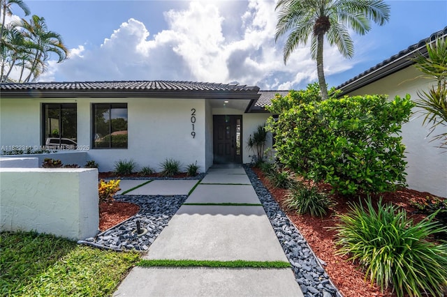 2019 NW 108th Ln, Coral Springs, FL 33071 - view of front of property featuring stucco siding and a tile roof