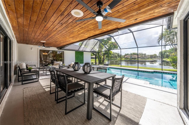 2019 NW 108th Ln, Coral Springs, FL 33071 - view of patio / terrace featuring a ceiling fan, an outdoor pool, glass enclosure, a water view, and outdoor dining space