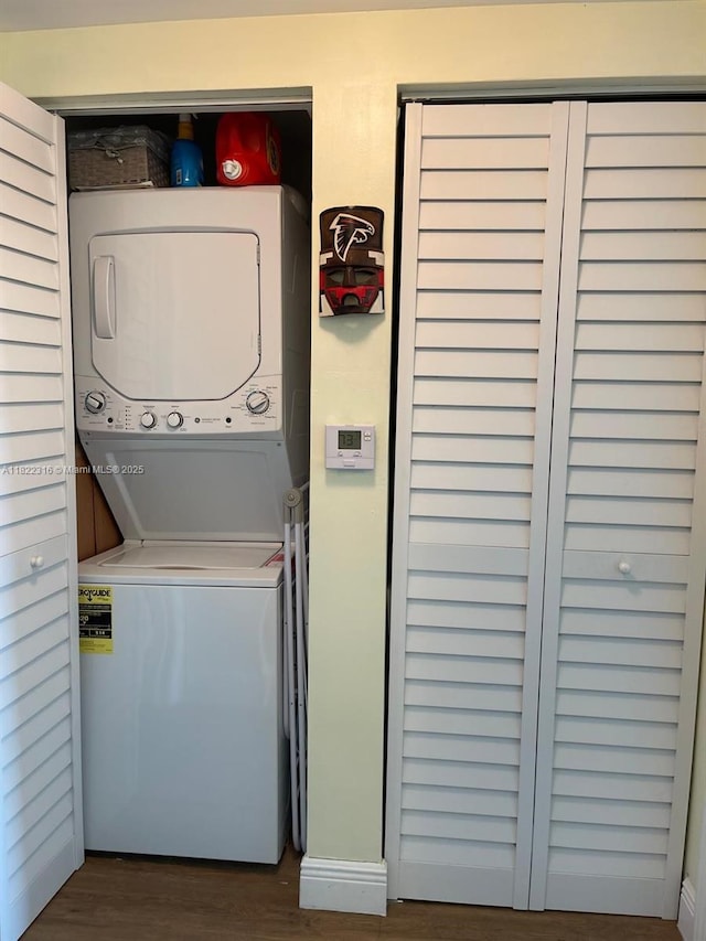 117 NW 42nd Ave Unit 1506, Miami, FL 33126 - laundry area with stacked washing machine and dryer and dark wood-style flooring