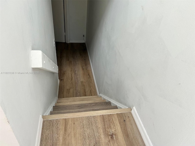 12666 NW 14th Pl Unit 12666, Sunrise, FL 33323 - stairway with wood finished floors and baseboards