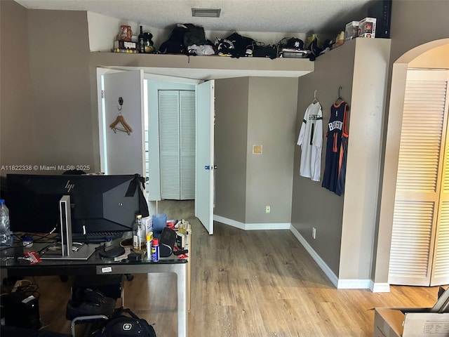 12666 NW 14th Pl Unit 12666, Sunrise, FL 33323 - home office with wood finished floors and arched walkways