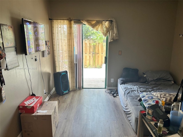 12666 NW 14th Pl Unit 12666, Sunrise, FL 33323 - bedroom featuring access to exterior and wood finished floors