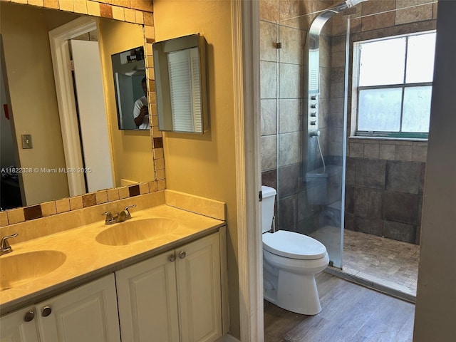 12666 NW 14th Pl Unit 12666, Sunrise, FL 33323 - full bathroom with tiled shower, double vanity, and wood finished floors